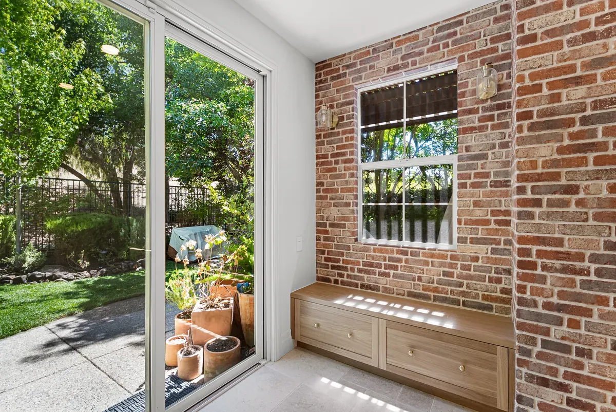 Sliding door onto the paved patio and garden of the completed Dublin CA remodel
