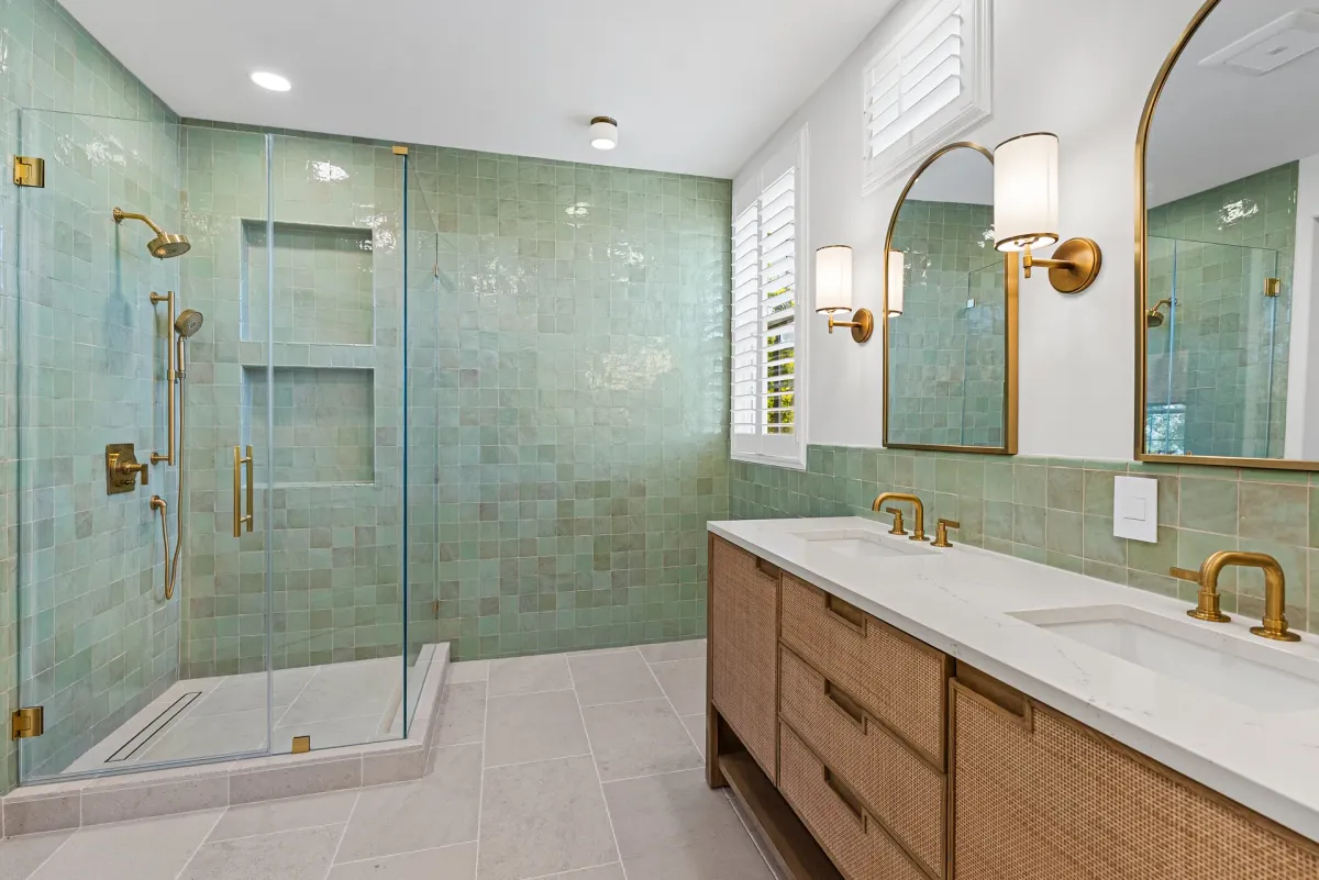 Remodeled primary bathroom with green zellige tile, glass shower and oak double vanity, Dublin CA