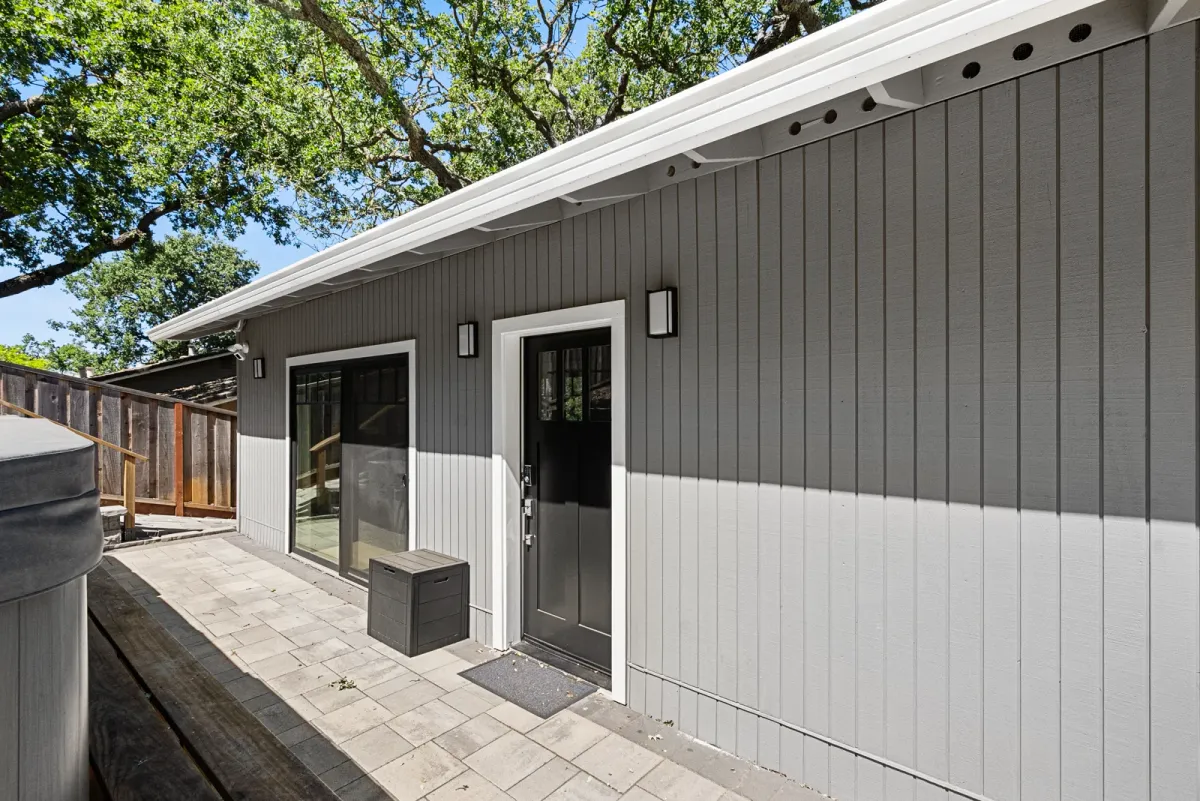Entry door and paver patio of the Monte Sereno JADU